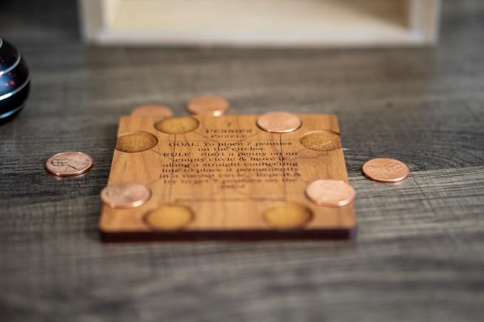 Creative Crafthouse 7 Pennies Puzzle, Wood Coin Brain Teaser, Made in USA | The real US cents are included, nothing else to buy. Slide each one in a straight line to its circle. A 3.6 inch desk gift