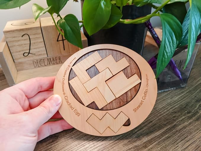 Creative Crafthouse Cracked Egg Wood Brain Teaser Puzzle for Adults | Fit all 6 wood pieces into the egg-shaped opening. A level 8 of 10 Stewart Coffin dissection puzzle, made in the USA.